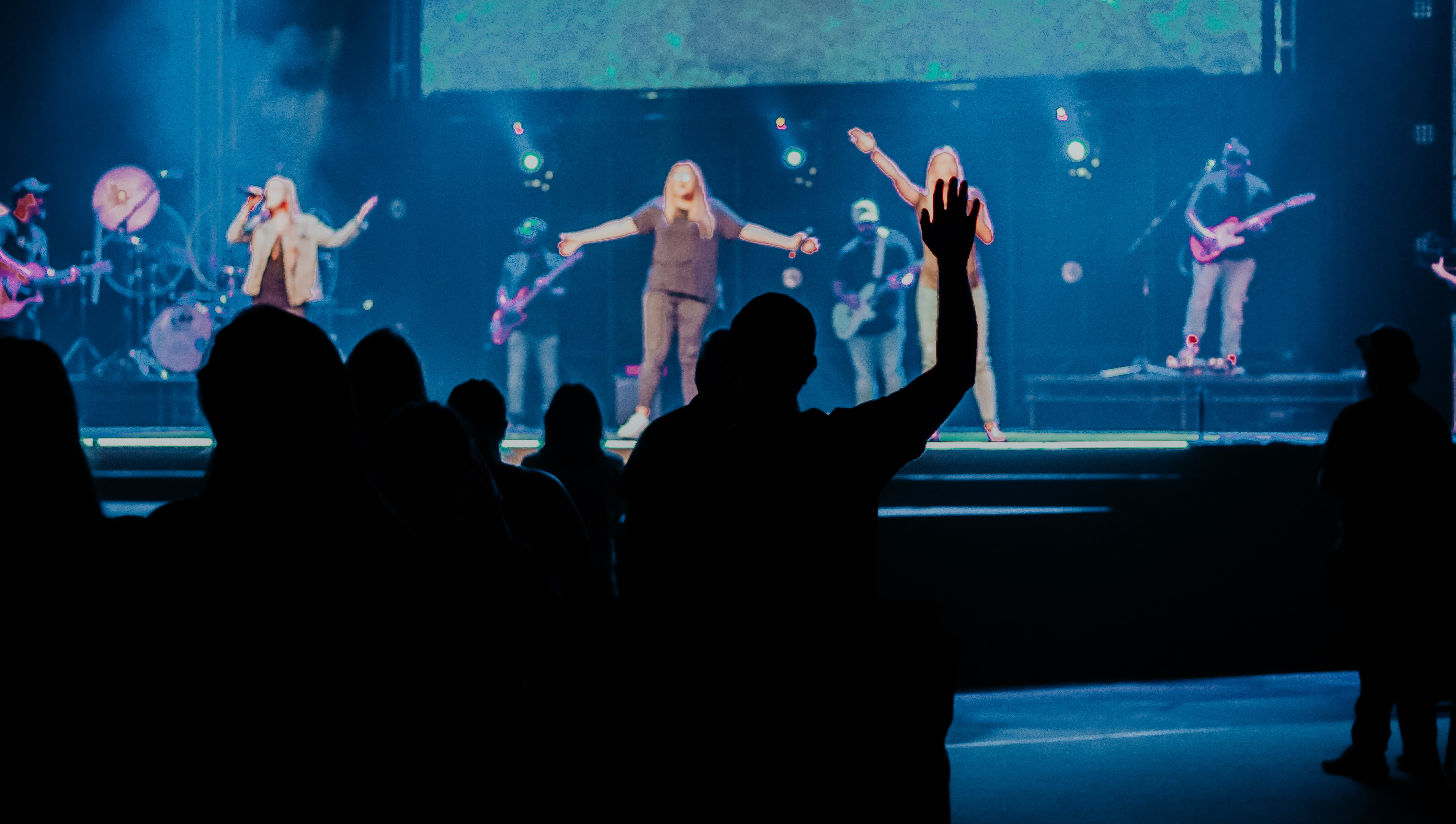 Adults worshiping together during a Sunday service at Marathon Church